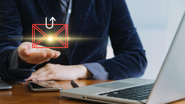 Smishing attack, sms spam phishing from scammer, concept. Red envelope with hook icon in criminal hacker hand who use mobile smart phone cyberattack sending scam malware spreading virus text message. - Powered by Adobe