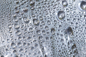Close up abstract background of water drop condensation. This wet, fresh, pure liquid on clear surface has cool, refreshing texture and feeling of moisture