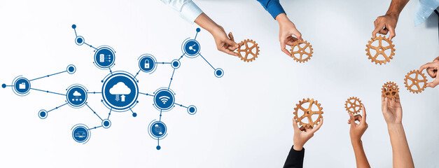 Explore the dynamic connection of hands holding gears, illustrating the integration of cloud computing and digital transformation in modern business environments. Amity