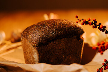 Freshly baked artisan bread on a rustic table with decorative elements during golden hour