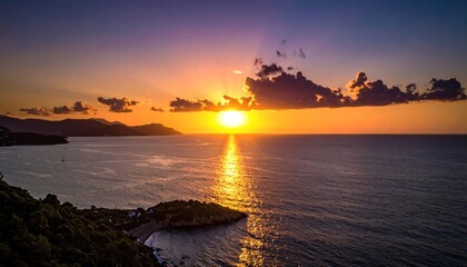 Aerial view of a radiant sunset over a tranquil ocean