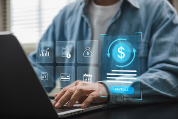 Payroll digital management system showing person operating financial software on laptop for salary...