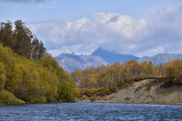 View on the mountain from the river in autumn