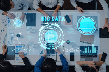 A diverse team collaborates on big data analysis, utilizing digital interfaces and analyzing statistics in a professional office setting, showcasing teamwork and innovation. Trope