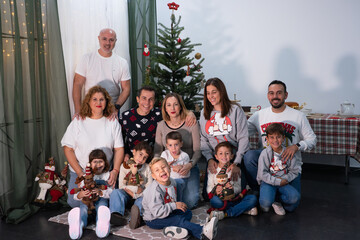 Extended family celebrating christmas holiday with children