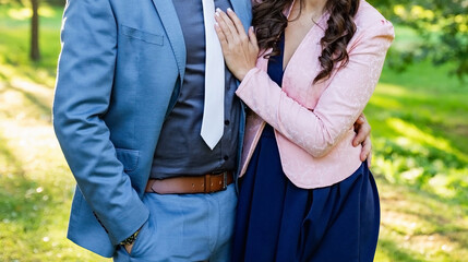 Young couple standing outdoor next to each other