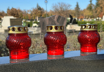 Candlelits on a tombstone in the public cemetery