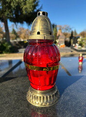 Candlelit on a tombstone in the public cemetery