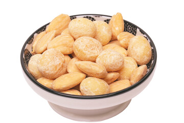 Nuts background. Close-up of roasted and salted macadamias and almonds nuts in ceramic bowl isolated on a white background. Gourmet nut mix with macadamias. Macro.