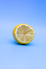 Half-Dried yellow lemon on a blue background, close