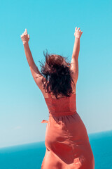Girl is enjoying summer vacation at the turquoise sea