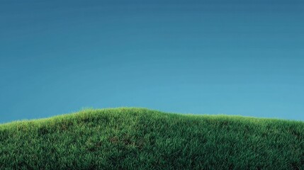 Lush Green Grass Hill Under a Clear Blue Sky at Dawn, Perfect for Nature Backgrounds and Outdoor Themes with Fresh and Inviting Atmosphere