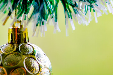 Close up of golden Christmas balls with customizable space for text or wishes.