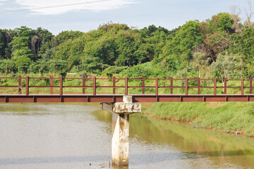 a pedestrian bridge over a river