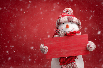 Snowman with a red sign