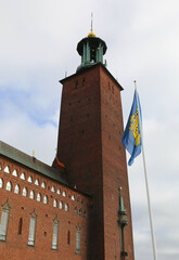 Town Hall with Bell Tower and Stockholm Flag with  Blue sky background in Stockholm, Sweden