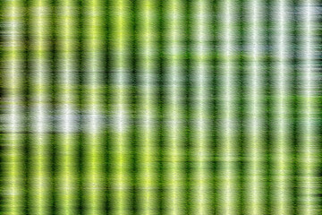 vibrant green and white vertical stripe abstract background. high contrast light effect on rough textured surface with grain.