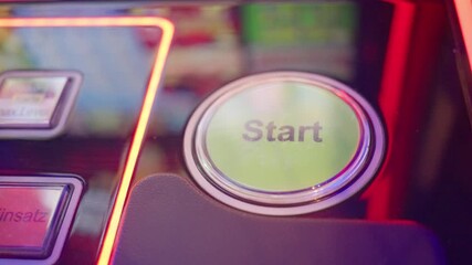 colorful glowing game control, closeup of illuminated slot machine start button in vibrant casino scene, captivating shot of luminous slot machine start button amidst lively casino ambiance - Powered by Adobe