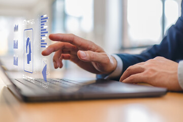 Close-up of male hands working on laptop keyboard in modern office. Businessman typing or browsing, symbolizing digital communication, remote work or online business.
