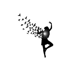 Black silhouette of a woman releasing a flock of flying birds from her chest, concept of freedom
