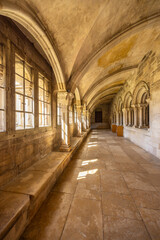Fototapeta premium Vezelay Basilica cloister hall with sun illuminating stone arches