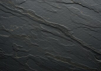 Natural dark gray slate surface displays rough, layered geological texture