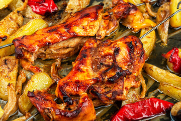 Chicken skewers souvlaki with roasted potatoes.