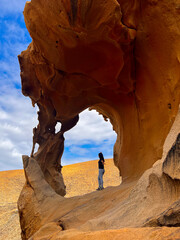 Young Woman Exploring the Arches of Las Peñitas, Fuerteventura