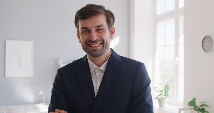Portrait of a happy businessman, leader or boss standing in the office with arms crossed, smiling at the camera, exuding positivity, leadership, and business professionalism in role as a chief.