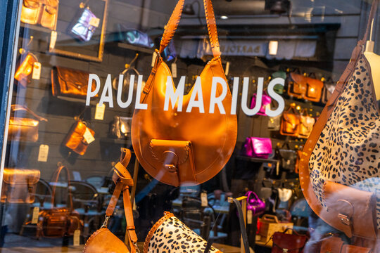 Paris, France - October 30, 2025: Paul Marius brand bags store entrance. Signboard brand logo. Window case street exterior.