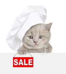 Cute kitten wearing chef's hat looking above blank white banner,  showing signboard with labeled "sale" and thumbs up gesture. isolated on white background