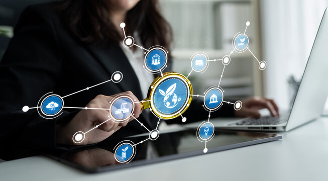 A focused businesswoman explores digital icons on her laptop, representing various concepts such as data analysis, research, and modern networking in the corporate world. Crux - Powered by Adobe