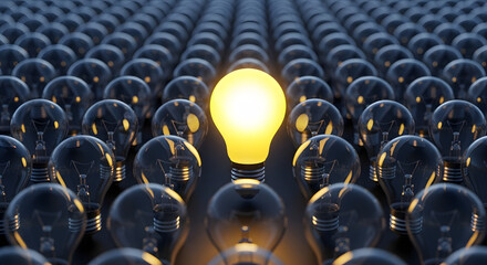 Obraz premium Brilliant illuminated lightbulb stands out amongst many unlit ones symbolizing innovation and unique ideas ready to inspire