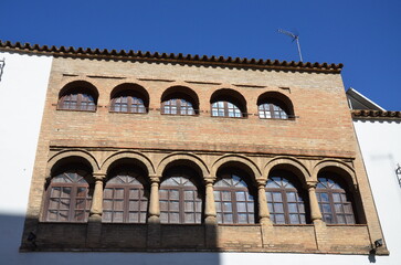 Obraz premium Cordoba, Spain 03.27.2019: House on Calle San Fernando with old water trough set in wall