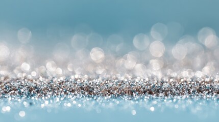 Shimmering Silver Glitter Background with Soft Bokeh Effect and Gentle Blue Tones for Creative Projects and Design Uses