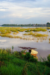 Rustic river hut and flooded grassland along the Mekong River, Vientiane, Laos