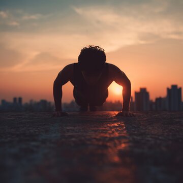 Man doing push-ups at dawn 