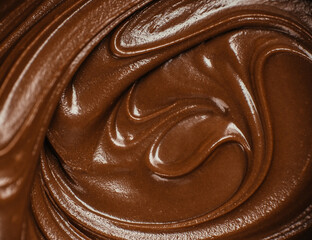 Close-up of smooth melted chocolate texture with glossy swirls, macro view of creamy liquid chocolate background for dessert or confectionery design