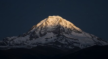 The way moonlight illuminates a silver mountain peak.