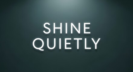 A minimalist illuminated sign displaying the words 'SHINE QUIETLY' against a dark background, emphasizing calmness and subtlety in design