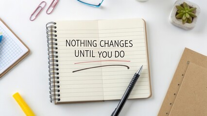 Spiral notebook with motivational message and erased line