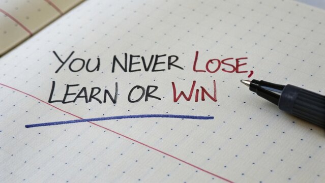 Text on paper with pen emphasizing learning and improvement