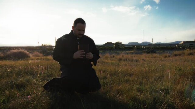 God Light Hitting A Priest Praying On The Grass