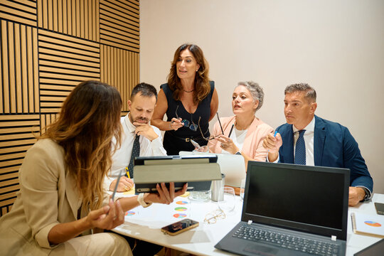 Business professionals having a team meeting in office