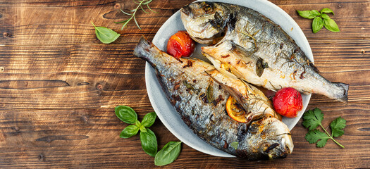 Roasted whole sea bream fish or dorado.