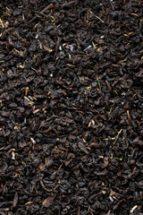 Fresh Black Tea Leaves with Dried Flowers and Fruit Macro Shot