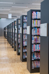 The library bookshelves are neatly arranged.