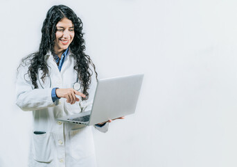 Female young doctor using and pointing laptop isolated. Smiling Woman doctor using laptop on isolated background
