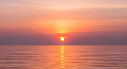 Obraz premium Serene Ocean Sunset with Warm Hues Reflecting on Calm Waters