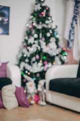 Cozy Christmas Living Room with Blurred Tree Lights